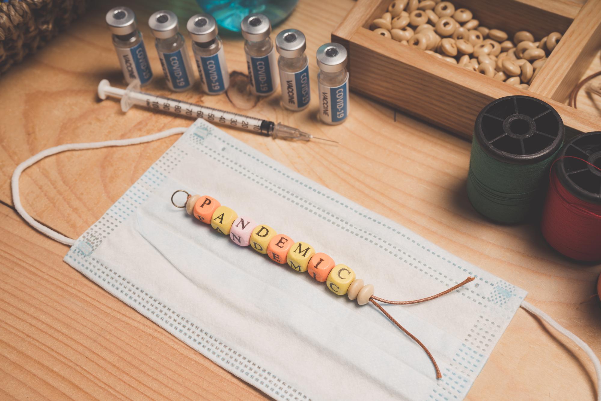 Workspace with threads, needles and emblem samples